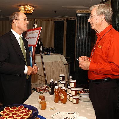 Tom Figel (Left), Figel Public Relations of Chicago, discusses business with Larry Stephen, Labrador Preserves, at the Taste of Atlantic Canada reception on Monday, October 3, 2005 in Chicago, Illinois.