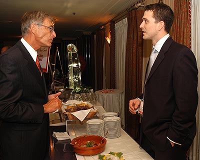 Rob Power of Ocean Choice International talks to Senator James Cowan during the Taste of Atlantic Canada reception on Monday, October 3, 2005.