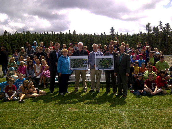 Minister Kevin O'Brien is joined by members of the Portugal Cove - St. Philips Town Council and the children of the summer camp and Conservation Corps programs for the announcement of the 2012-14 Multi-Year Municipal Capital Works for the community.