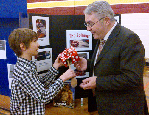 Brother Rice Junior High student Artemis Strangecrow discusses the scientific principles behind his science fair project with Education Minister Clyde Jackman, who was at the school Tuesday (March 12) to mark Science Month in Newfoundland and Labrador.