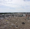 Before photo of the New Harbour waste disposal site.