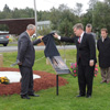 The Honourable Kevin O'Brien, Minister of Municipal Affairs and MHA for Gander, joined by the Right Reverend David Torraville, Anglican Bishop of Central Newfoundland, Mayor of Appleton, Derm Flynn and Consul General of the United States to Halifax, Richard Reilly, unveiling a monument in the Town of Appleton during commemoration ceremony for 9/11 attacks.