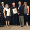 The Honorable Keith Hutchings, Minister of Innovation, Business and Rural Development, receives the Compass International Award for 2013 with the department’s Ocean Technology Branch. Pictured from left to right: Ed Janes, Daryl Genge, Shelly Petten, Darrell O'Neill, Minister Keith Hutchings, Diane Taylor, and Neil Gall, September 2013.