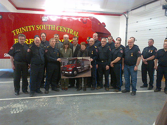 The Honourable Kevin O'Brien, Minister of Municipal Affairs and the Honourable Charlene Johnson, Minister of Child, Youth and Family Services and MHA for Trinity-Bay de Verde with members of the Trinity South Central Fire Department.