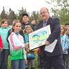 In Corner Brook, students from St. Peter’s Academy and Immaculate Heart of Mary attended the Day in the Park event with conservation officers. The students learned about the many aspects of forest protection, including forest fire fighting, and were on hand when Humber West MHA Vaughn Granter presented Abby Hynes, a Grade 6 student at St. Peter’s Academy, with a framed copy of her winning entry into the National Forest Week Poster Contest – September 2013