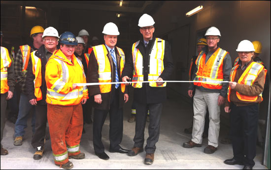 Honourable Paul Davis, Minister of Transportation and Works and Honourable Keith Hutchings, Minister of IBRD and MHA for Ferryland cut the ribbon to officially open the new highway depot in Renews-Cappahayden.