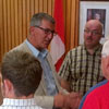 The Honourable Paul Davis, Minister of Transportation and Works, and Clayton Forsey, MHA for Exploits, speak to residents at the town hall in Bishop's Falls following the announcement of $1.5 million in road work upgrades for the Exploits region.
