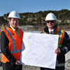 The Honourable Nick McGrath, Minister of Transportation and Works, and the Honourable Dan Crummell, Minister of Service NL and MHA for St. John's West, hold a map showing the location of underpasses currently under construction for the Team Gushue Highway Extension Project - October 30, 2013