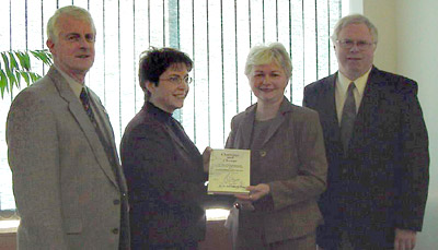 (L-R) Steve MacLean, P.Eng., Executive Director, APEGN; Karen Thomas, P.Eng., APEGN president; Education Minister Judy Foote; and author, Donald Tarrant, P.Eng.