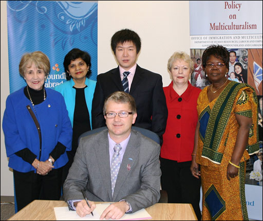 Minister King signing Multicultural week proclaimation