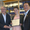 The Honourable Clyde Jackman, Minister of Education, presents Gander Collegiate student Abby Moss with the Safe and Caring Schools Graduating Student Award, with the Honourable Kevin O’Brien, Minister of Municipal Affairs and MHA for Gander.