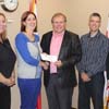 The Honourable Tom Hedderson, Minister of Environment and Conservation, provides funding for climate change education to Conservation Corps Newfoundland and Labrador executive.  L-R: Megan Stuckless, Danielle Little, Minister Hedderson, Darren Feltham and Terry McNeil