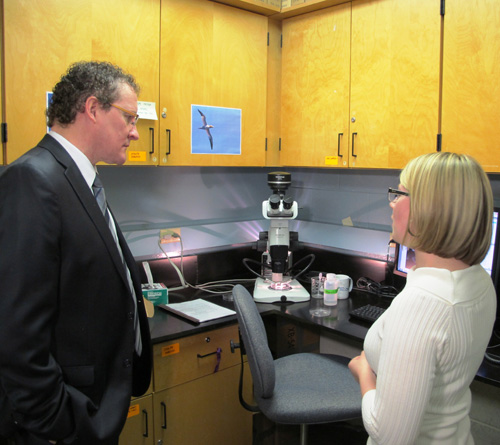 The Honourable Derrick Dalley, Minister of Fisheries and Aquaculture, receiving a demonstration in the Centre for Fisheries Ecosystems Research lab at the Fisheries and Marine Institute. April 15, 2013.
