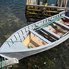 Photo 1: A 17 foot boat and motor seized by Fish and Wildlife Enforcement Officers as the result of an investigation into illegal salmon netting in the Conche area of the Northern Peninsula, June 18, 2013.
