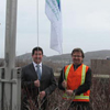 The Honourable Nick McGrath, Minister of Service NL, raises the North American Occupational Safety and Health Week flag with Mr. Mark Balsom, Chair of the Newfoundland and Labrador Chapter of the Canadian Society of Safety Engineers.